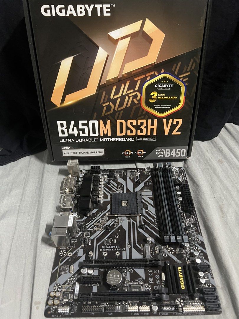Gigabyte B450M DS3H V2 Motherboard AMD Socket AM4 (Category: Computer Parts) located in Binangonan. Submitted by matthew.299 (Listing ID 1445655125, Image 2). Description: - Gigabyte B450M DS3H V2 Motherboard - Supports AMD Ryzen 5000 Desktop Processors - Socket AM4 - Ultra Durable Design - Includes I/O Shield - Ready for your PC build.