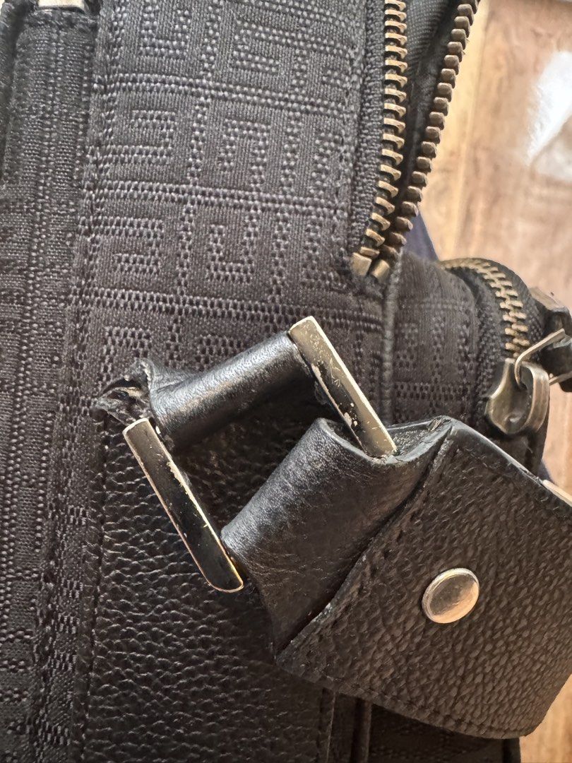 Givenchy Black sling Bag (Category: Luxury Bags & Wallets) located in General Trias. Submitted by dexgav (Listing ID 1445693840, Image 3). Description: - Authentic Givenchy black leather bag - Interior lining with Givenchy logo pattern - Includes a small inner pocket - Ideal for everyday use Preloved.condition 7.5 /10 Negotiable madali kausap Location:cavite general trias.