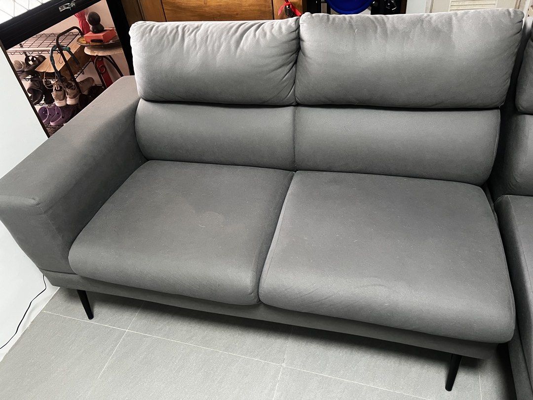 Grey L-Shaped Sectional Sofa (Category: Sofas) located in Cavite. Submitted by maddie_12 (Listing ID 1445690323, Image 2). Description: - Comfy grey L-shaped sectional sofa - Adjustable headrests for extra comfort - Soft, touchable fabric - Slim black legs - Ideal for lounging and entertaining - Fits most living spaces - Easy to clean.