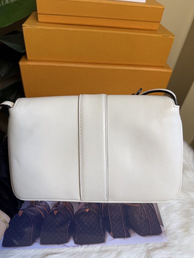 Gucci Marmont White Leather Shoulder Bag (Category: Luxury Bags & Wallets) located in Caloocan City. Submitted by marj_bags (Listing ID 1445646131, Image 2). Description: - Authentic white leather Gucci Marmont shoulder bag - Iconic gold GG logo hardware - Adjustable strap for versatile wear - Pristine interior condition - Comes with original dust bag - Ideal for both daily use and special events.