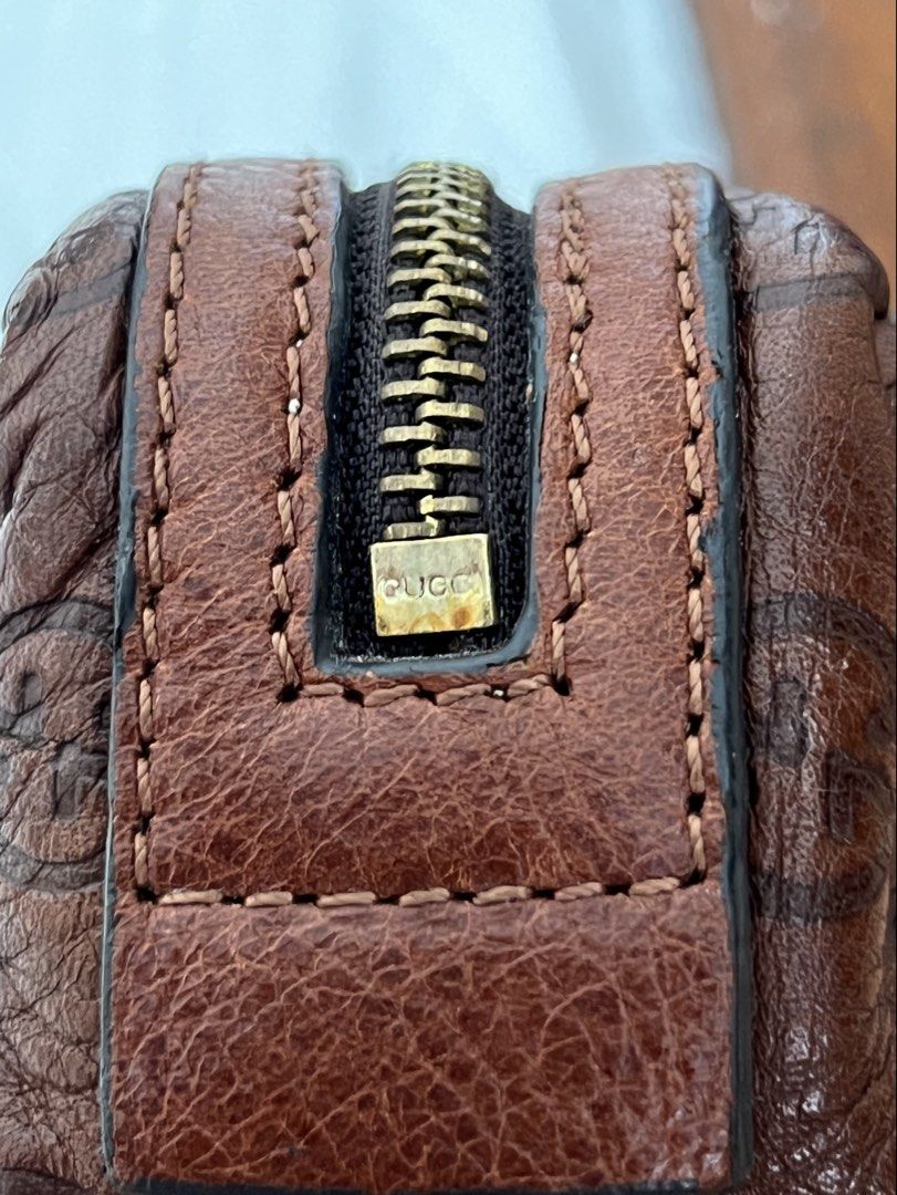 Gucci Pouch (Category: Luxury Bags & Wallets) located in Manila. Submitted by tesmultimarcasempire (Listing ID 1440549470, Image 2). Description: 🛍️ FOR SALE: GUCCI Mini Pouch / Coin Purse – Brown Guccissima Leather Brand: GUCCI Style: Mini pouch / coin purse / small accessory bag Color: Rich brown Material: Guccissima embossed leather (signature GG monogram pattern) Hardware: Silver-tone zipper with heart-shaped GUCCI charm Details: • Interior 
