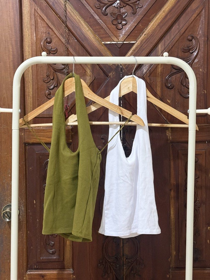 Halter Neck Tank Tops - Olive Green & White (Category: Sleeveless) located in Iloilo. Submitted by wornwellco (Listing ID 1445686637, Image 1). Description: - Set of 2 halter neck tank tops - Colors: Olive Green and White - Material: Soft and stretchy fabric - Versatile: Great for layering or wearing on its own - Style: Effortlessly chic for casual looks - Features: Comfortable and breathable.