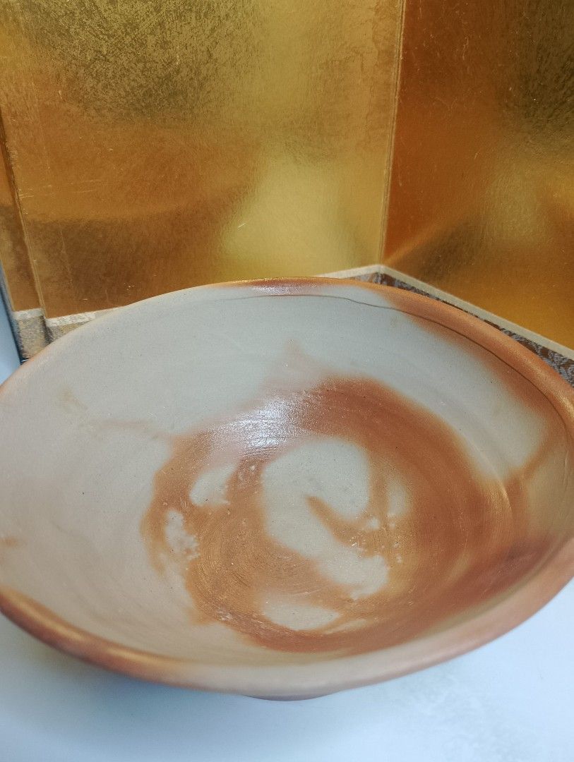 Handmade Stoneware Bowl with Swirl Design (Category: Other Kitchenware & Tableware) located in Valenzuela. Submitted by buylaaaaa (Listing ID 1445643746, Image 2). Description: - Unique handmade ceramic bowl - Features a beautiful natural swirl pattern - Earthy tone colors - Maker's marks on the base - Dimensions: Approx. 13cm diameter x 5cm height - Ideal for serving food or as a decorative accent piece.