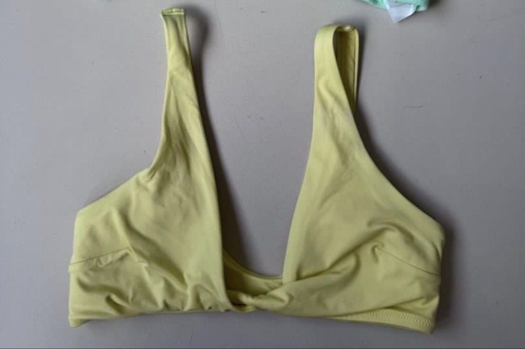 H&M Yellow Twist Front Bikini Top Size 2 (Category: Bikinis & Swimsuits) located in Manila. Submitted by decluterthings888 (Listing ID 1445637160, Image 2). Description: - Brand: H&M - Item: Bikini Top - Color: Yellow - Size: 2 - Design: Twist front detail - Material (Shell): 86% Polyamide, 14% Elastane - Material (Lining): 88% Polyester, 12% Elastane - Origin: Made in Bangladesh.