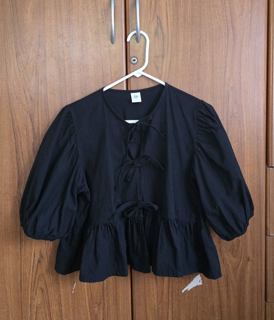 HTP Black Peplum Tie-Front Puff Sleeve Top (Category: Blouses) located in Urdaneta. Submitted by kcasi (Listing ID 1445724423, Image 2). Description: HTP brand from IG XL on tag Like new, barely used First photo grabbed from HTP instagram acct. Actual when worn in the last photo. *White color is sold already*.