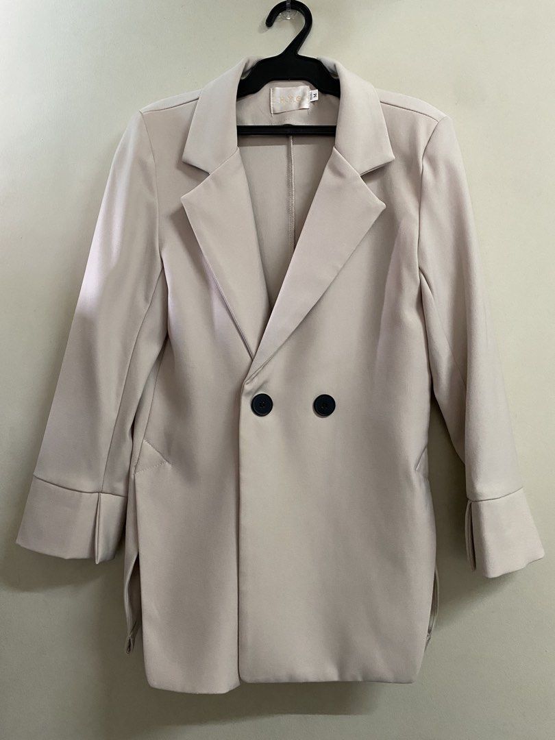 H.Y.G. Double-breasted Beige Blazer (Category: Coats, Jackets and Outerwear) located in Binangonan. Submitted by mcgthrifts (Listing ID 1445759438, Image 1). Description: - Beige double-breasted blazer - Features two black buttons at the front - Cuffed sleeves with a split hem - Versatile for layering over tops or dresses - Color may cary due to lighting, actual color at 3rd photo and 4th. - See 4th photo, when worn. 🫶 .