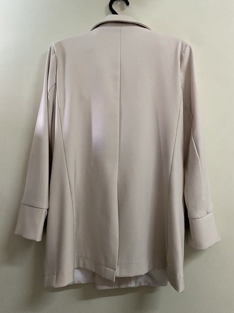 H.Y.G. Double-breasted Beige Blazer (Category: Coats, Jackets and Outerwear) located in Binangonan. Submitted by mcgthrifts (Listing ID 1445759438, Image 2). Description: - Beige double-breasted blazer - Features two black buttons at the front - Cuffed sleeves with a split hem - Versatile for layering over tops or dresses - Color may cary due to lighting, actual color at 3rd photo and 4th. - See 4th photo, when worn. 🫶 .