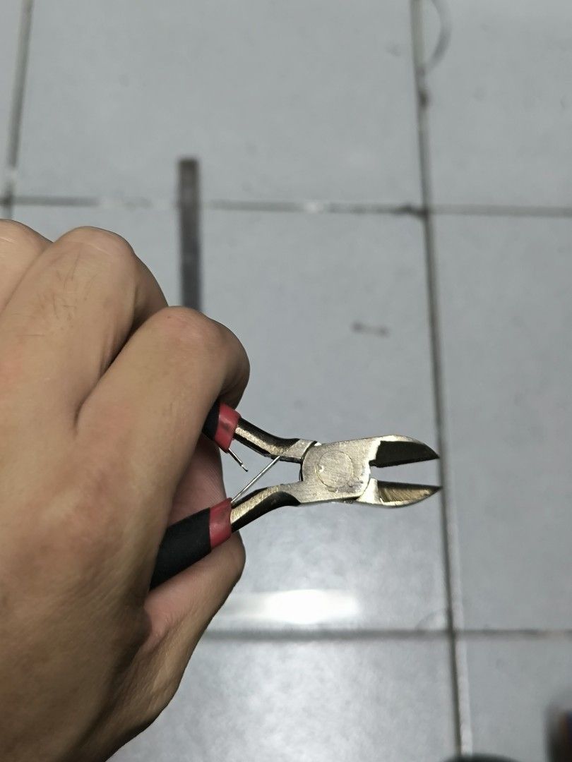 Japan Quality Wire Cutters Pliers Side Cutters (Category: Construction Tools & Equipment) located in Angeles City. Submitted by yellowbrickstore (Listing ID 1445669927, Image 2). Description: - Small wire cutters - Black handles with red accents - Ideal for electronics or crafting projects - Shows some signs of use, but still cuts effectively - A practical and handy tool to have shipping via jnt express Saturday sked only Friday cut off pick up A