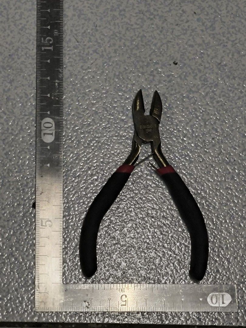 Japan Quality Wire Cutters Pliers Side Cutters (Category: Construction Tools & Equipment) located in Angeles City. Submitted by yellowbrickstore (Listing ID 1445669927, Image 3). Description: - Small wire cutters - Black handles with red accents - Ideal for electronics or crafting projects - Shows some signs of use, but still cuts effectively - A practical and handy tool to have shipping via jnt express Saturday sked only Friday cut off pick up A
