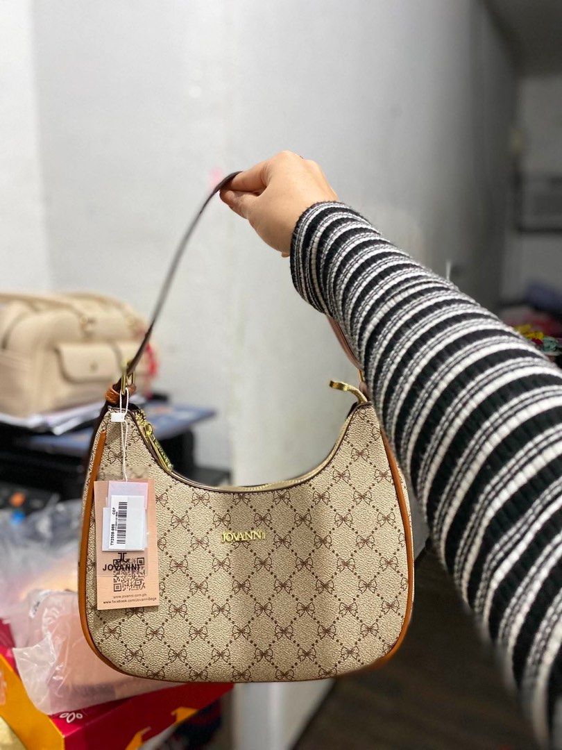 JOVANNl Monogram Hobo Bag (Category: Luxury Bags & Wallets) located in Antipolo. Submitted by mingot05 (Listing ID 1445786859, Image 1). Description: - JOVANNl monogram hobo bag - Classic brown and beige pattern - Tan trim and gold hardware - Comes with original tags - Ideal size for everyday essentials - Adjustable strap.
