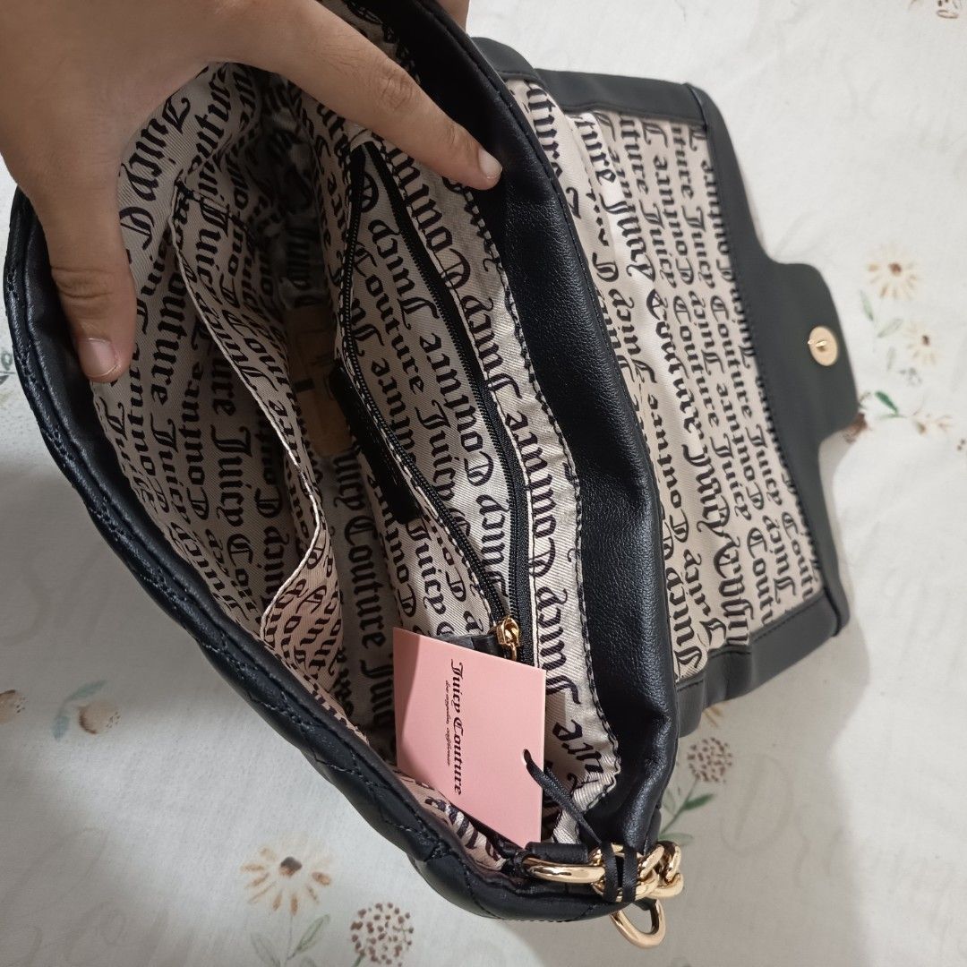 Juicy Couture Black Quilted Heart Bag (Category: Luxury Bags & Wallets) located in Pasig City. Submitted by wafflestore (Listing ID 1445609846, Image 3). Description: Authentic with papertag. Never used. It's $80 uwi from the US but it doesn't match my aesthetic 🥲 Spacious with back pocket, inner pocket, and zipped pocket. Juicy Couture lining inside. Gold JC logo with rhinestones on the front flap. Quilted heart pattern. No issues. Payment thro