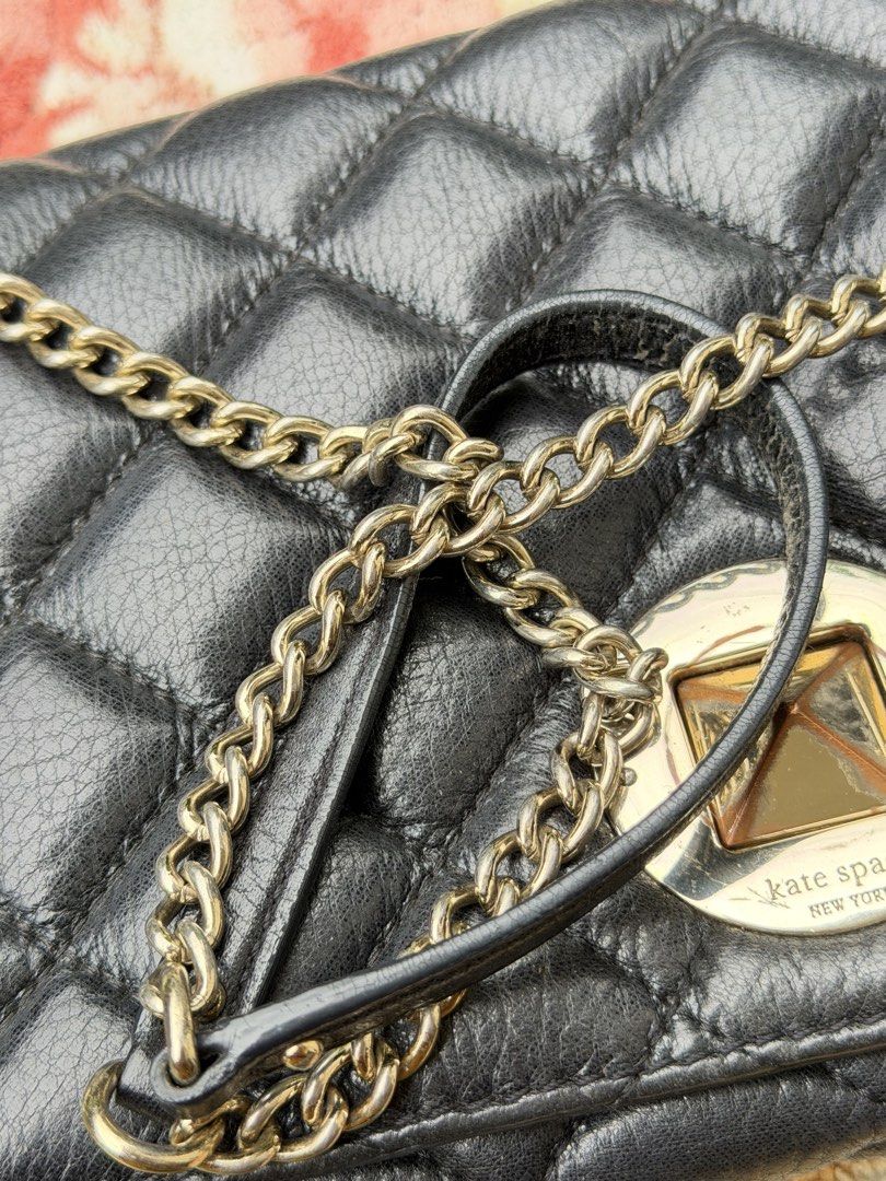 Kate Spade Black Quilted Leather Chain Shoulder Bag (Category: Shoulder Bags) located in Tabuk. Submitted by pheym18 (Listing ID 1445693335, Image 3). Description: - Brand: Kate Spade - Material: Black quilted leather - Closure: Turn-lock - Strap: Chain strap - Condition: signs of wear on hardware and leather trim - Versatile: Ideal for everyday use or evening events.