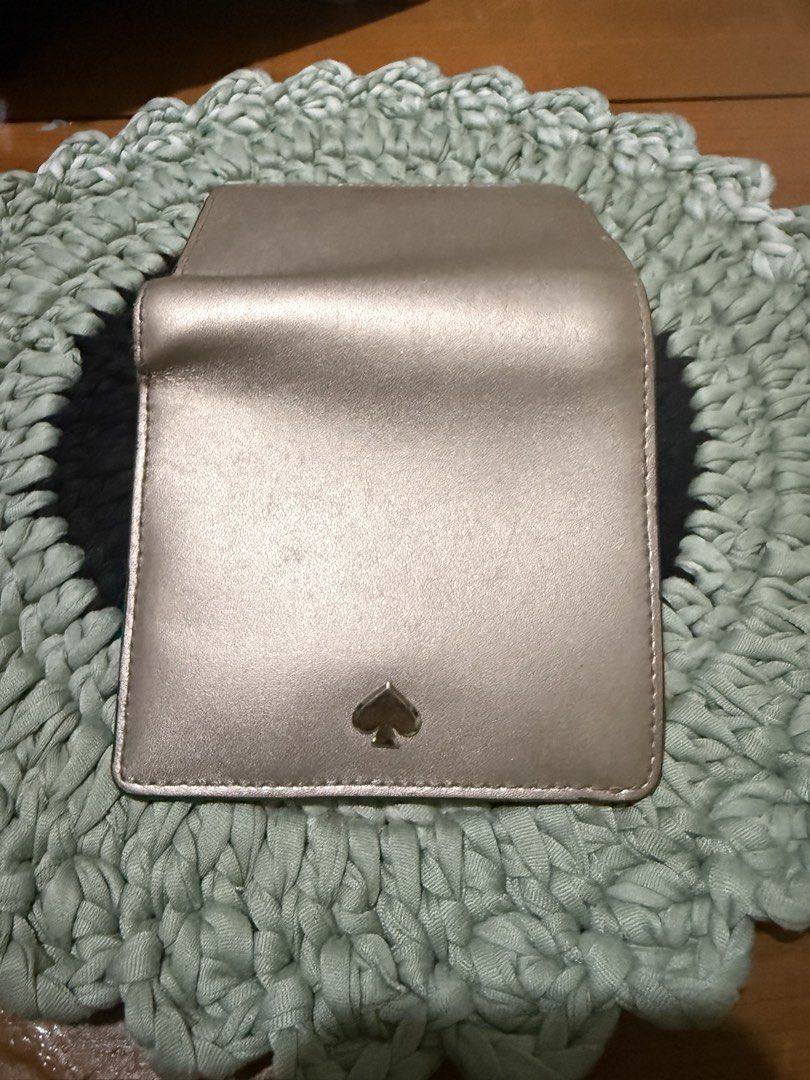 Kate Spade New York Metallic Wallet (Category: Wallets & Card holders) located in Manila. Submitted by handpickedbycox (Listing ID 1445634878, Image 3). Description: - Brand: Kate Spade - Color: Rose Gold Metallic - Condition: with original tags and care card - Features: Compact size, snap closure -Ask all you want -No COD - No return No refund - ship ng ia J&T .