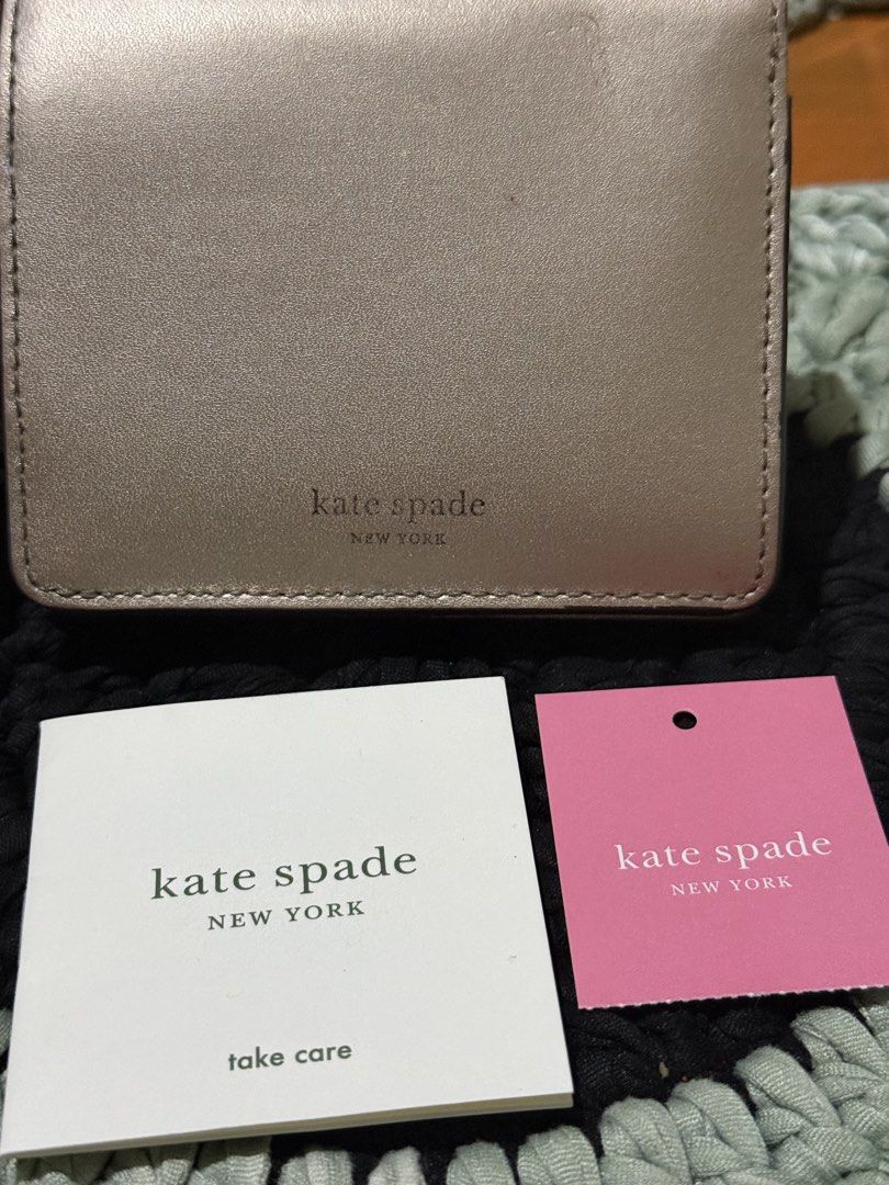 Kate Spade New York Metallic Wallet (Category: Wallets & Card holders) located in Manila. Submitted by handpickedbycox (Listing ID 1445634878, Image 1). Description: - Brand: Kate Spade - Color: Rose Gold Metallic - Condition: with original tags and care card - Features: Compact size, snap closure -Ask all you want -No COD - No return No refund - ship ng ia J&T .