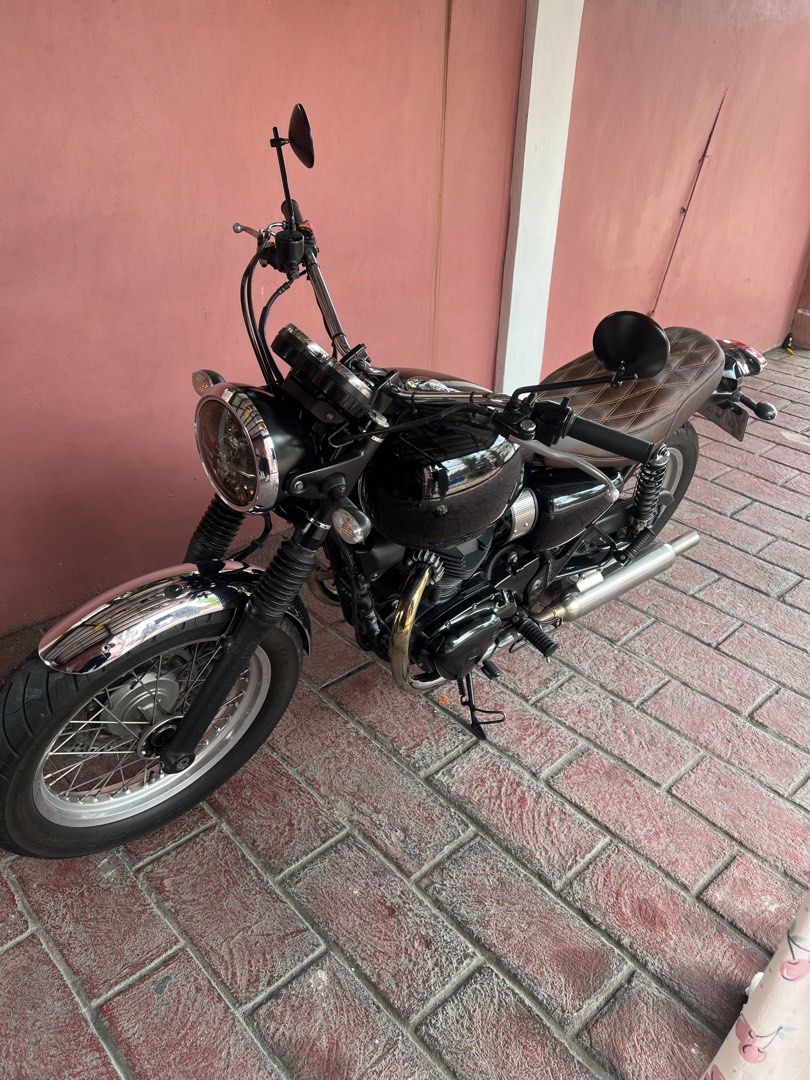 Kawasaki W800 2020 model (Category: Motorbikes for Sale) located in Pasig City. Submitted by eeeeessss (Listing ID 1445634961, Image 2). Description: Kawasaki W800 2020 model 2023 acquired with a custom brown diamond-stitched seat and wide british bar. Recently serviced ( PMS, brake pads ) Bassy exhaust Almost new tires Gas tank wrapped in black Newly registered 18k ODO as of posted Rfs: planning to upgrade to triumph Open for swap to triumph spe
