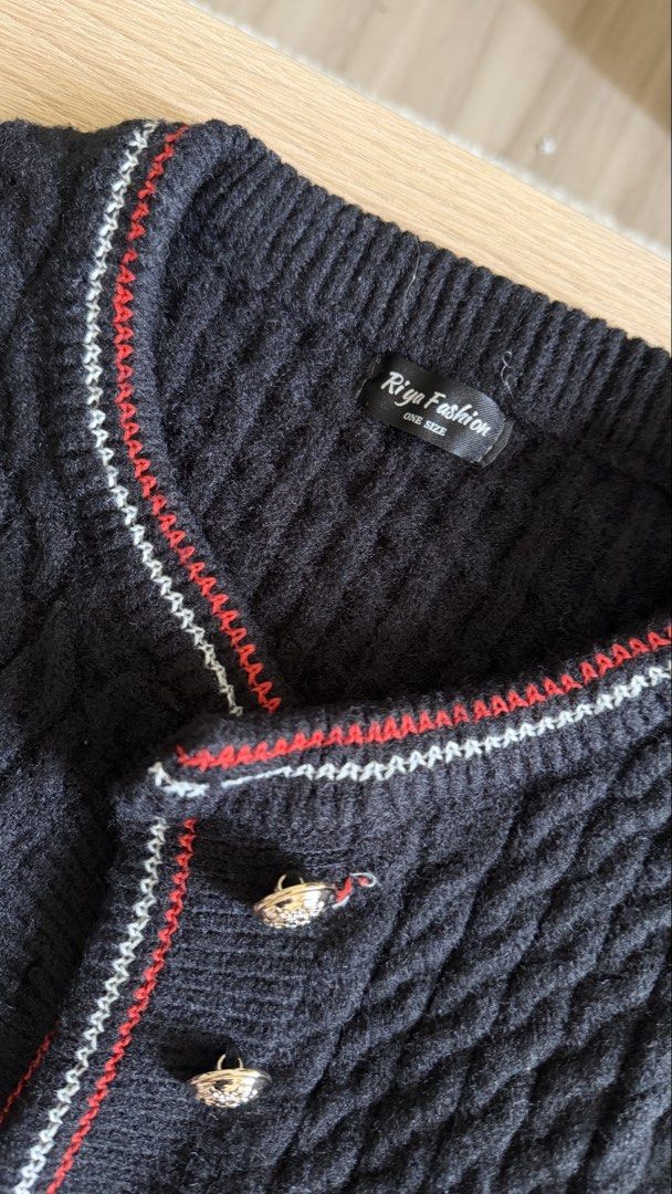 Knitted cardigan black (Category: Coats, Jackets and Outerwear) located in Makati City. Submitted by declutterwithella (Listing ID 1445612148, Image 3). Description: Brand: Riya Fashion from TikTok Size: Free size but best fits XS Color: Black with red and white lining.
