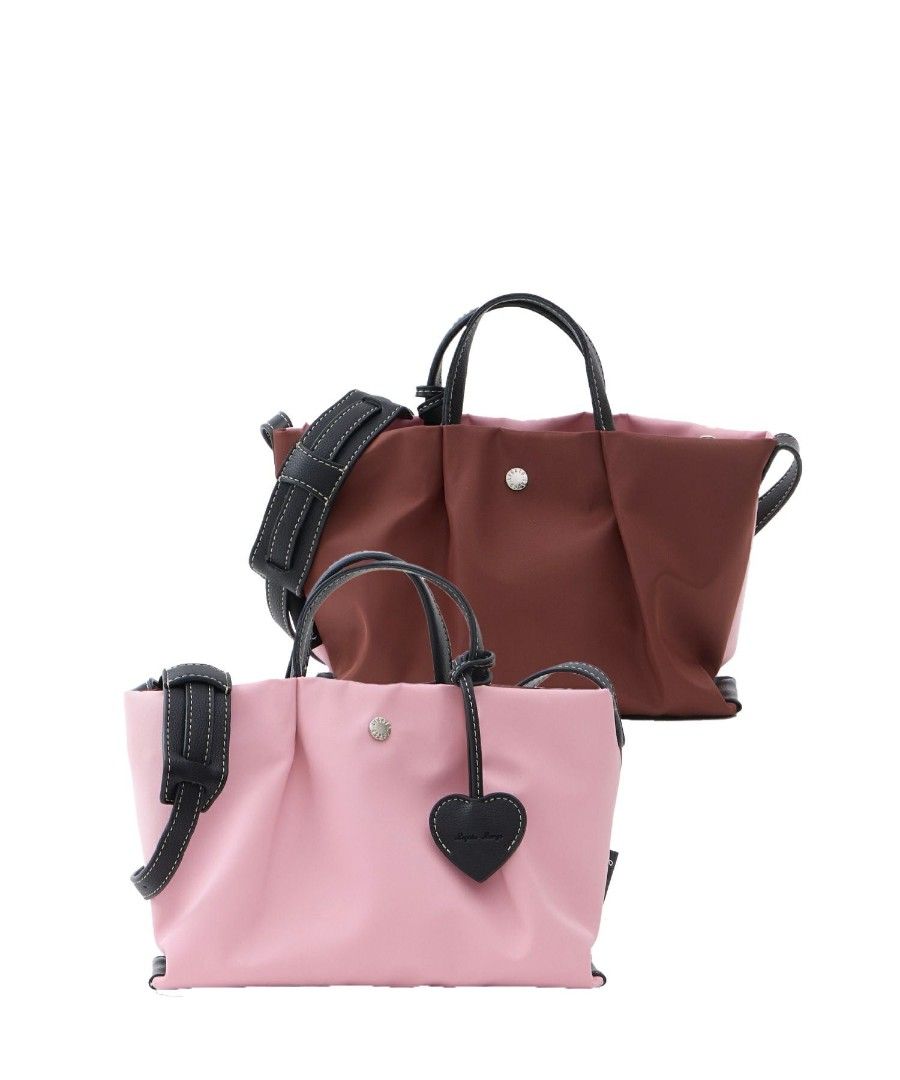 Legato Largo Double Face Mini Shoulder Bag Pink/Brown (Category: Shoulder Bags) located in Caloocan City. Submitted by keansy (Listing ID 1445718432, Image 2). Description: - Double Face Legato Largo mini shoulder bag - Versatile: use as handbag or shoulder bag - Comes with a detachable heart charm - Brand new with tags still attached (Sealed) - Ideal for daily use or travel - Water-repellent nylon purse featuring a distinct pink and brown color 