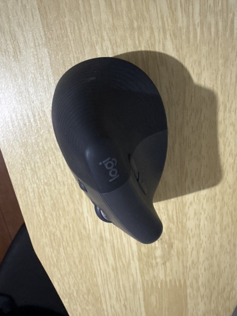 Logitech MX Lift Vertical Ergonomic Mouse (Category: Mouse & Mousepads) located in Las Pinas. Submitted by paolamang (Listing ID 1445708753, Image 3). Description: - Logitech MX Vertical Mouse - Color: Dark Grey - Ergonomic design for ultimate comfort - Includes scroll wheel and buttons - Excellent working condition - Perfect for extended computer use.
