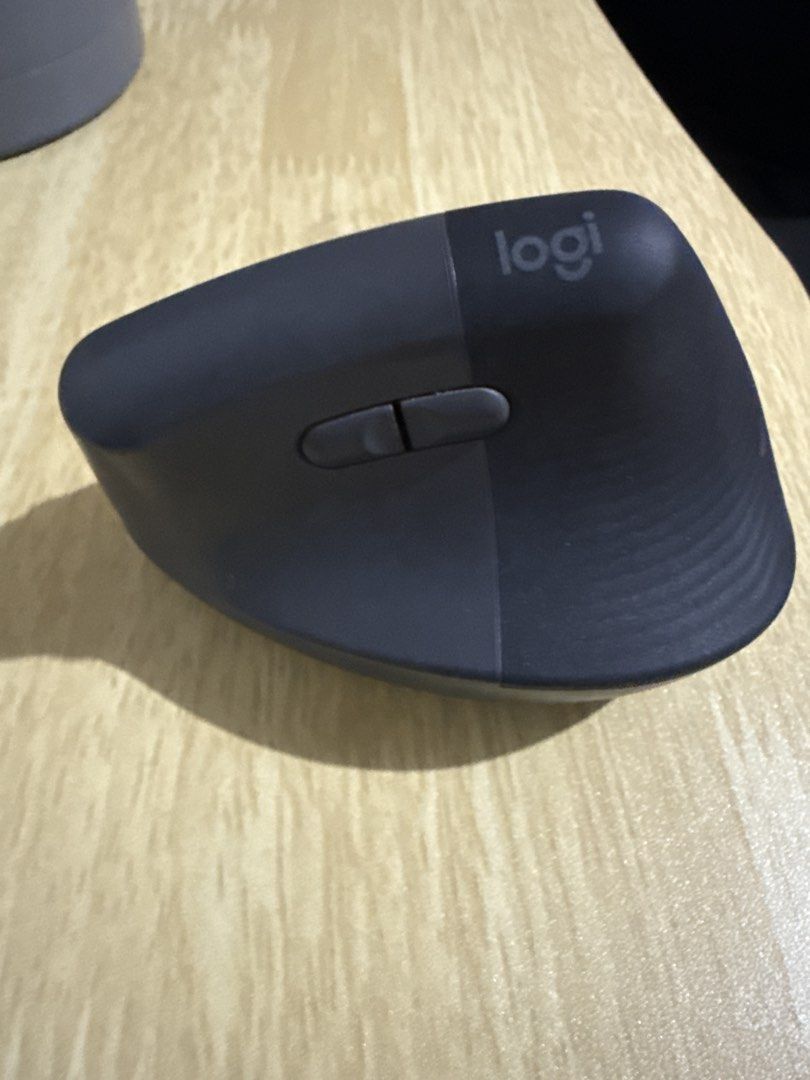 Logitech MX Lift Vertical Ergonomic Mouse (Category: Mouse & Mousepads) located in Las Pinas. Submitted by paolamang (Listing ID 1445708753, Image 1). Description: - Logitech MX Vertical Mouse - Color: Dark Grey - Ergonomic design for ultimate comfort - Includes scroll wheel and buttons - Excellent working condition - Perfect for extended computer use.