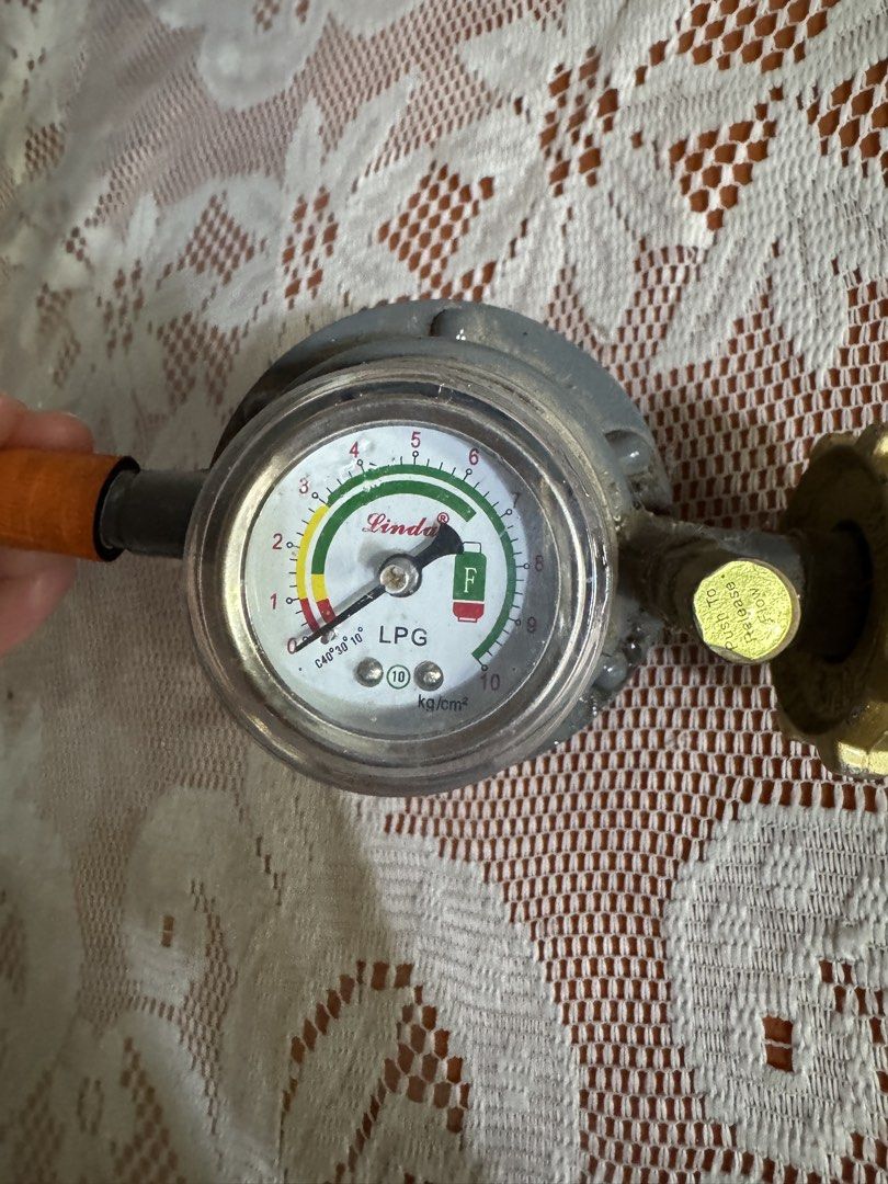LPG Regulator (Category: Cookware & Accessories) located in Manila. Submitted by valemie (Listing ID 1445679016, Image 2). Description: -This is a Lindax brand heavy-duty LPG gas regulator with a built-in pressure gauge. -The gauge features a “Push To Release Flow” button and indicates gas levels with color-coded safety zones.It is designed to automatically shut off gas flow if a leakage is detected. * Good in condition. We sell it because we onl