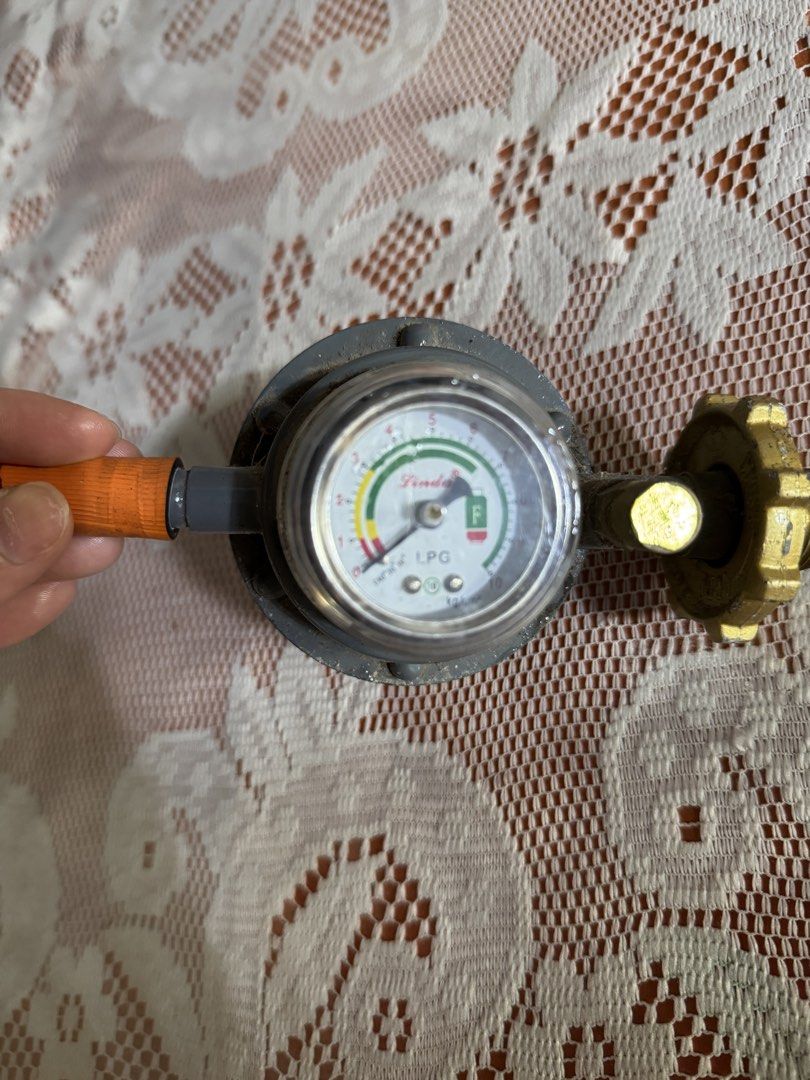 LPG Regulator (Category: Cookware & Accessories) located in Manila. Submitted by valemie (Listing ID 1445679016, Image 1). Description: -This is a Lindax brand heavy-duty LPG gas regulator with a built-in pressure gauge. -The gauge features a “Push To Release Flow” button and indicates gas levels with color-coded safety zones.It is designed to automatically shut off gas flow if a leakage is detected. * Good in condition. We sell it because we onl