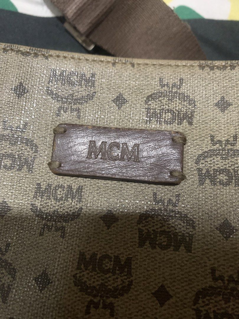 MCM Monogram Messenger Bag (Category: Luxury Bags & Wallets) located in Cagayan de Oro. Submitted by agboysalis60090 (Listing ID 1445624758, Image 3). Description: Authentic MCM messenger bag. Classic monogram pattern all over. Brown leather trim and strap. Zipper closure with interior pockets. Shows some signs of wear on the strap and edges. Still a great bag for everyday use. .