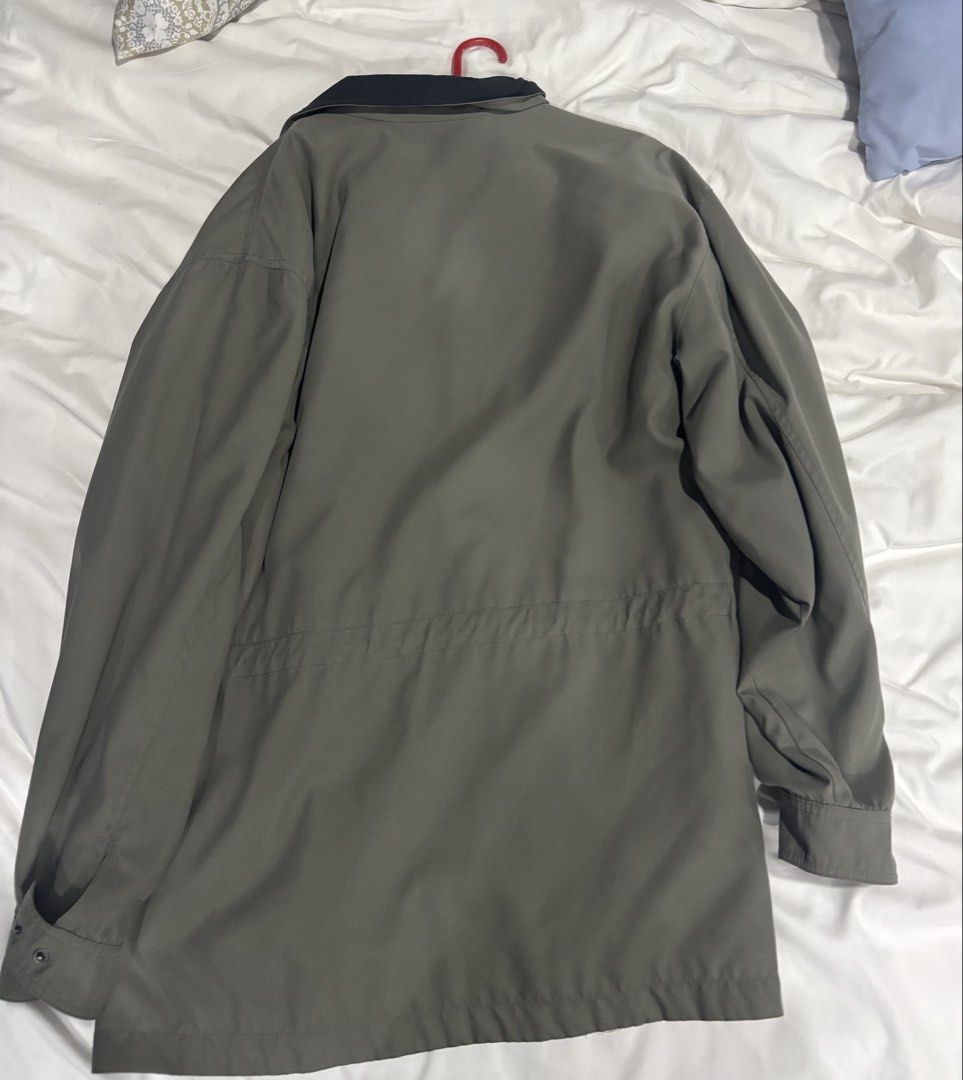 Men's Olive Green Jacket (Category: Coats, Jackets and Outerwear) located in Manila. Submitted by junjun_jomar (Listing ID 1445652102, Image 2). Description: - Olive green jacket - Dark blue collar - Zipper closure with button overlay - Two front zippered pockets - Drawstring waist at the back - Ideal for cooler weather.