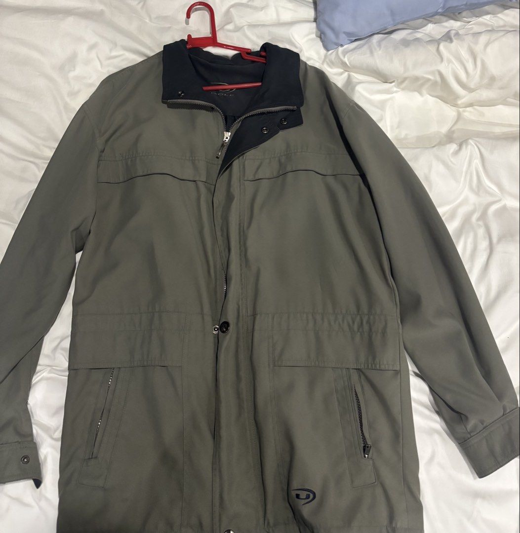Men's Olive Green Jacket (Category: Coats, Jackets and Outerwear) located in Manila. Submitted by junjun_jomar (Listing ID 1445652102, Image 1). Description: - Olive green jacket - Dark blue collar - Zipper closure with button overlay - Two front zippered pockets - Drawstring waist at the back - Ideal for cooler weather.