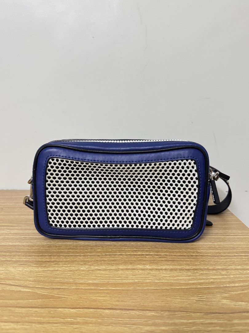 Michael Kors Blue Leather Mesh Crossbody Bag (Category: Cross-body Bags) located in Tarlac. Submitted by muchlovedstuffs (Listing ID 1445642870, Image 2). Description: - Authentic Michael Kors blue leather crossbody bag - Stylish white mesh front panel - Sleek silver hardware and zippers - Adjustable black strap with Michael Kors branding - Two spacious zip compartments - Ideal for everyday errands or travel adventures - No damage good as new.