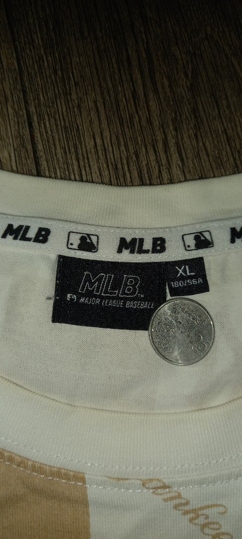 MLB New York Yankees Checkerboard All Over Print (Category: Tshirts & Polo Shirts ) located in Imus. Submitted by pampie (Listing ID 1445784372, Image 2). Description: - Cream and tan checkerboard pattern - All-over New York Yankees logo print - MLB branded - Size: L - Comfortable and stylish design - Perfect for any Yankees fan.