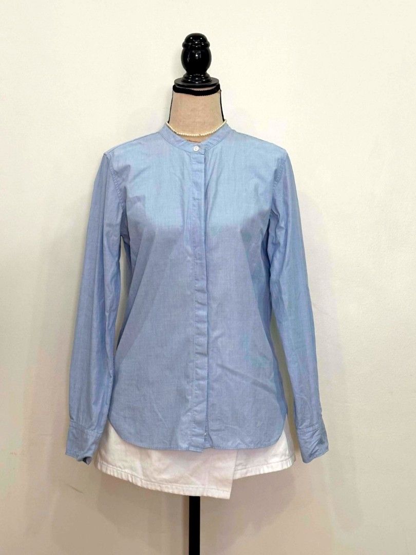MUJI (M) Light Blue Long Sleeve Button Up Shirt (Category: Longsleeves) located in Davao. Submitted by closetaccess (Listing ID 1445657563, Image 2). Description: - Light blue long sleeve shirt - Mandarin collar - Regular to slim fit fit - 100% cotton fabric - Size Medium (M) - Button-up front closure - Single button at collar - Button cuffs on sleeves.