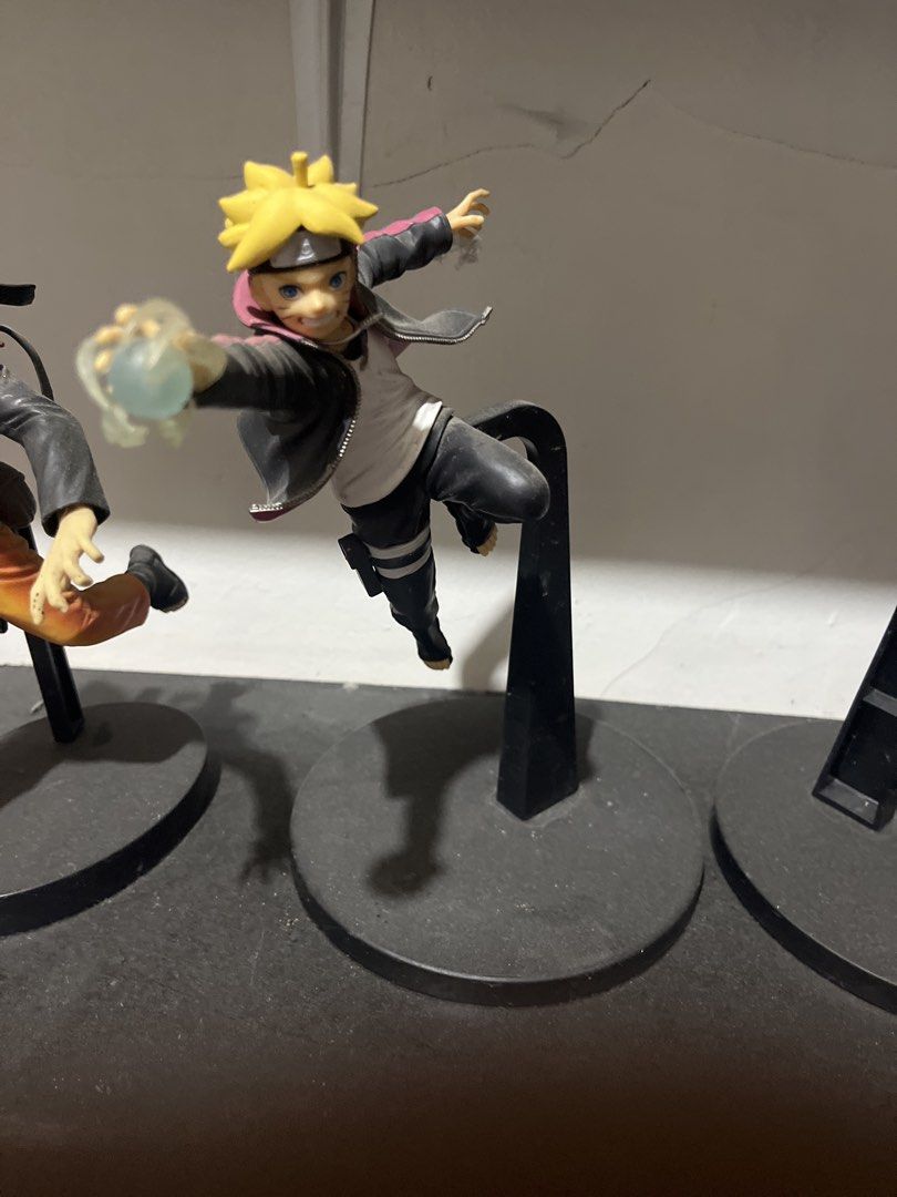 Naruto & Boruto Action Figures Set (Category: Figurines & Statues) located in San Manuel. Submitted by miguelitooooooo (Listing ID 1445731797, Image 2). Description: - Set of Naruto and Boruto action figures Authentic - Dynamic, action-ready poses - Mounted on display stands - Minor dust from display - Ideal for anime fans.