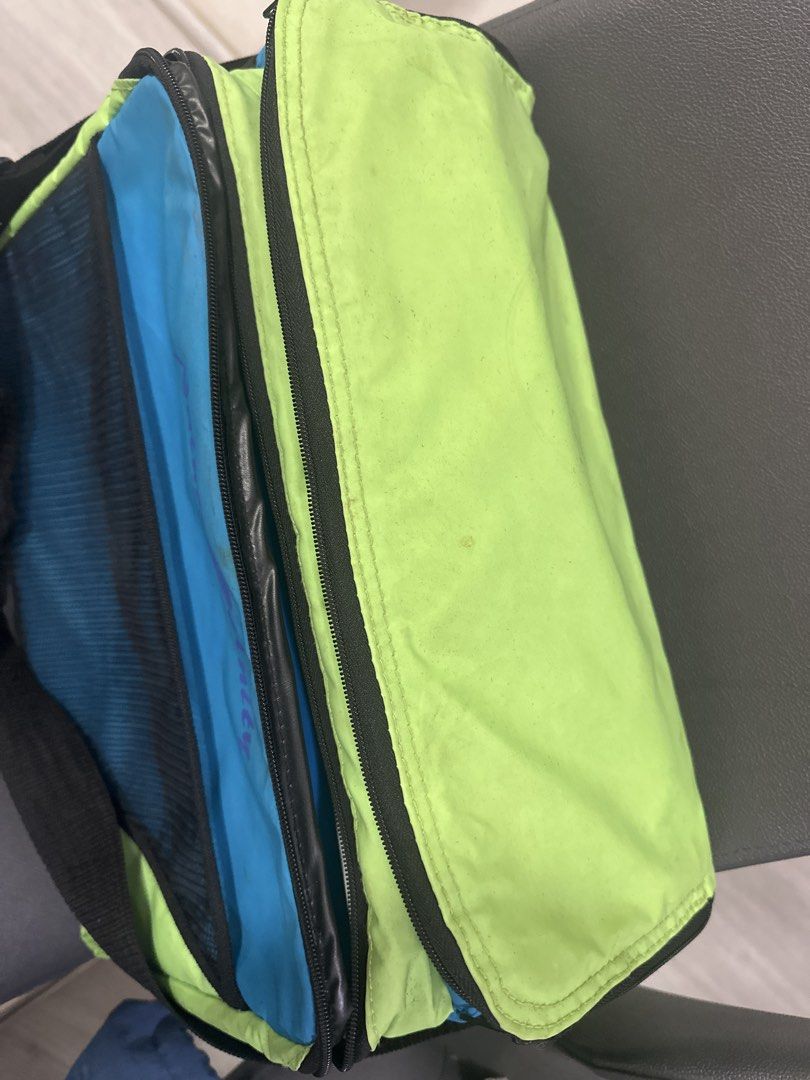 Nature Unity Cooler Bag (Category: Food Organization & Storage) located in Cainta. Submitted by shopbyyna (Listing ID 1445665636, Image 2). Description: - Vibrant lime green and blue cooler bag - Convenient front mesh pocket - Insulated and spacious interior for ample storage - Smooth-working zippers for easy access - Includes a comfortable shoulder strap for effortless carrying - Ideal for picnics, beach trips, or keeping beverages chilled Needs