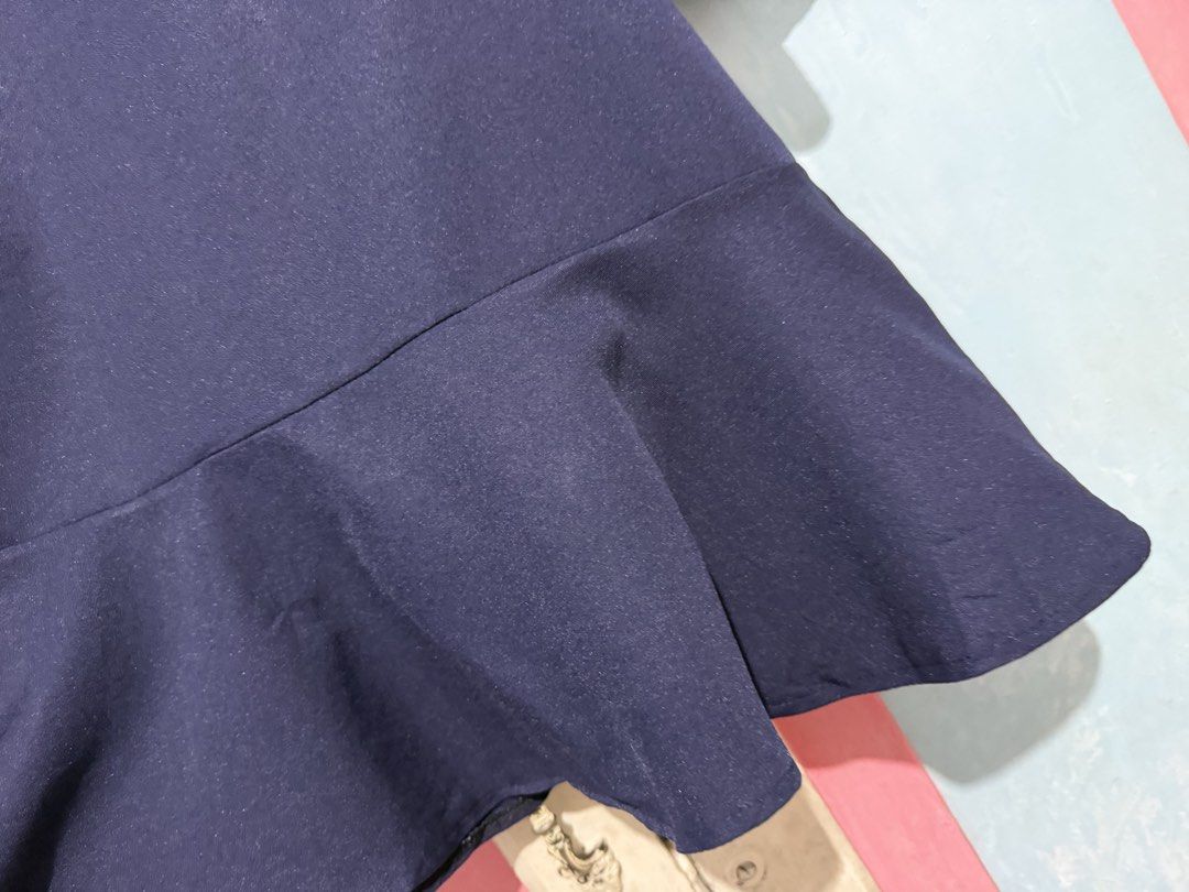 Navy Blue Dress with Gingham Sleeves (Category: Dresses) located in Manila. Submitted by prelovedbyshai_116 (Listing ID 1445630970, Image 3). Description: - Navy blue dress - Long gingham sleeves with ruffled cuffs - Flared, ruffled hem - Versatile for casual or dressy wear - Comfortable fabric -Fits small to medium.