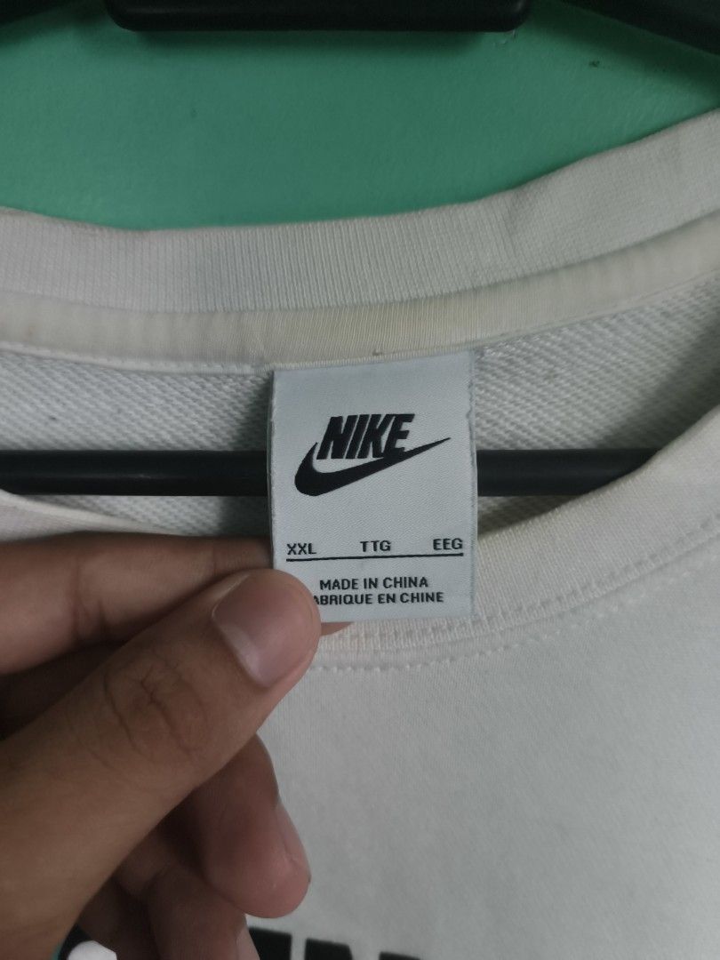 Nike China Crewneck Sweatshirt (Category: Coats, Jackets and Outerwear) located in Batangas. Submitted by 3ft_tan (Listing ID 1445654543, Image 2). Description: - White Nike crewneck sweatshirt - Size XL - Features 'CHINA' graphic across the chest - Teal Nike swoosh detail - Made in China - Ideal for casual wear -need wash -Excellent Conditon.