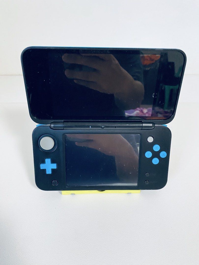 Nintendo 2DS XL Blue/Black - Includes Charger (Category: Nintendo) located in Caloocan City. Submitted by rjane1204 (Listing ID 1445623643, Image 2). Description: - Nintendo 2DS XL (Blue/Black) - Clean screens, no scratches - All buttons and joystick fully functional - Includes USB charging cable - Perfect for portable gaming on the go.