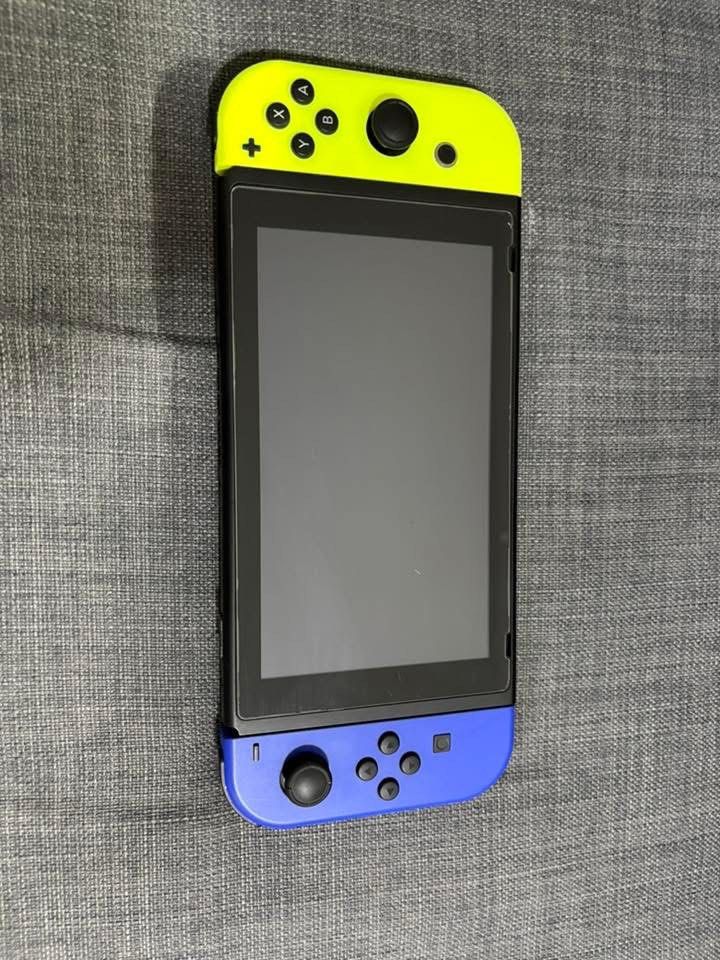 Nintendo Switch Console with Neon Blue and Yellow Joy-Cons (Category: Nintendo) located in Calauan. Submitted by thequeenwhoneverwas (Listing ID 1445641095, Image 3). Description: - Nintendo Switch Console v1 - Neon Blue & Neon Yellow Joy-Cons - Official Nintendo Switch Dock - Satisfye Carrying Case - All items in good, working condition - Ideal for both home and portable gaming - 3 physical games (Mario kart bought for 2k+, Resident evil & Morta