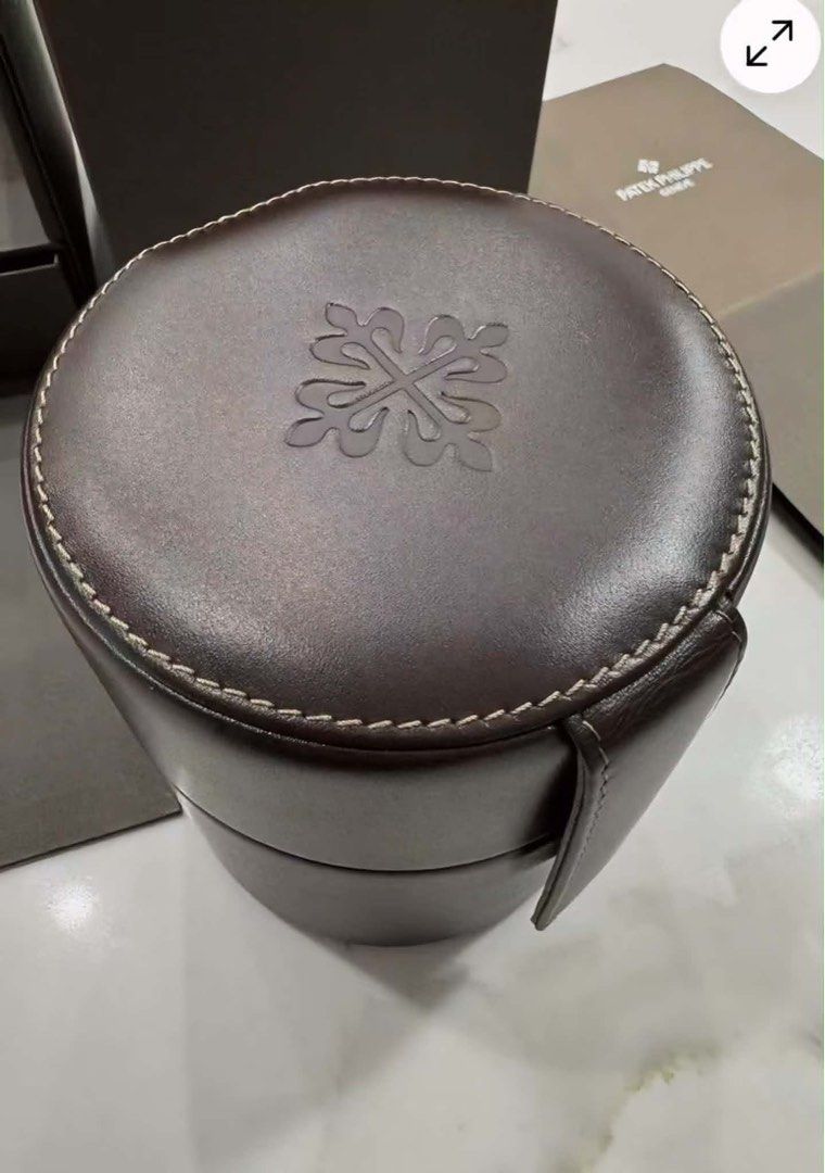Patek Philippe Geneve Watch winder (Category: Luxury Watches) located in Pasig City. Submitted by Watchaholics (Listing ID 1445751158, Image 3). Description: - Original Patek Philippe watch winder - Includes outer box and documentation - Made of dark brown leather with white stitching - watch winder - Comes with original Packing.