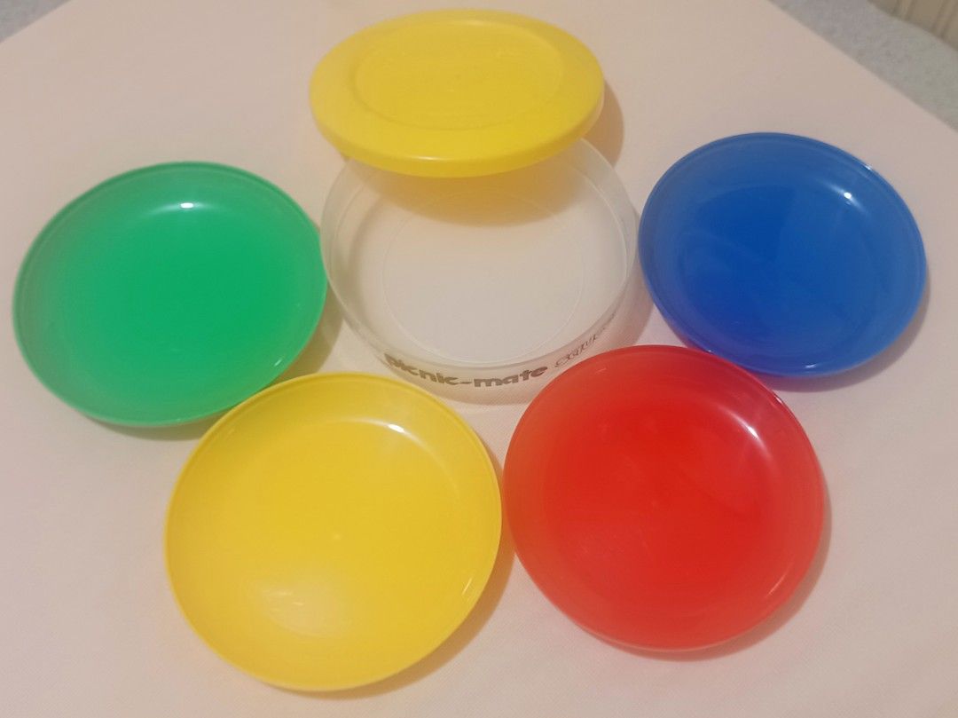 Perma‑Ware Picnic‑Mate Saucer Set — COMPLETE 4‑Color Stackable Set | Made in PH (Category: Food Organization & Storage) located in Quezon City. Submitted by wjmae (Listing ID 1445640701, Image 3). Description: ✨ Authentic classic Perma‑Ware picnic ware — fully intact, complete set! 🥗 What you get: • Clear storage base + secure yellow snap‑lid • 4 colorful saucers: bright green, sunny yellow, bold red, vivid blue — all nest neatly inside 📏 Size:
