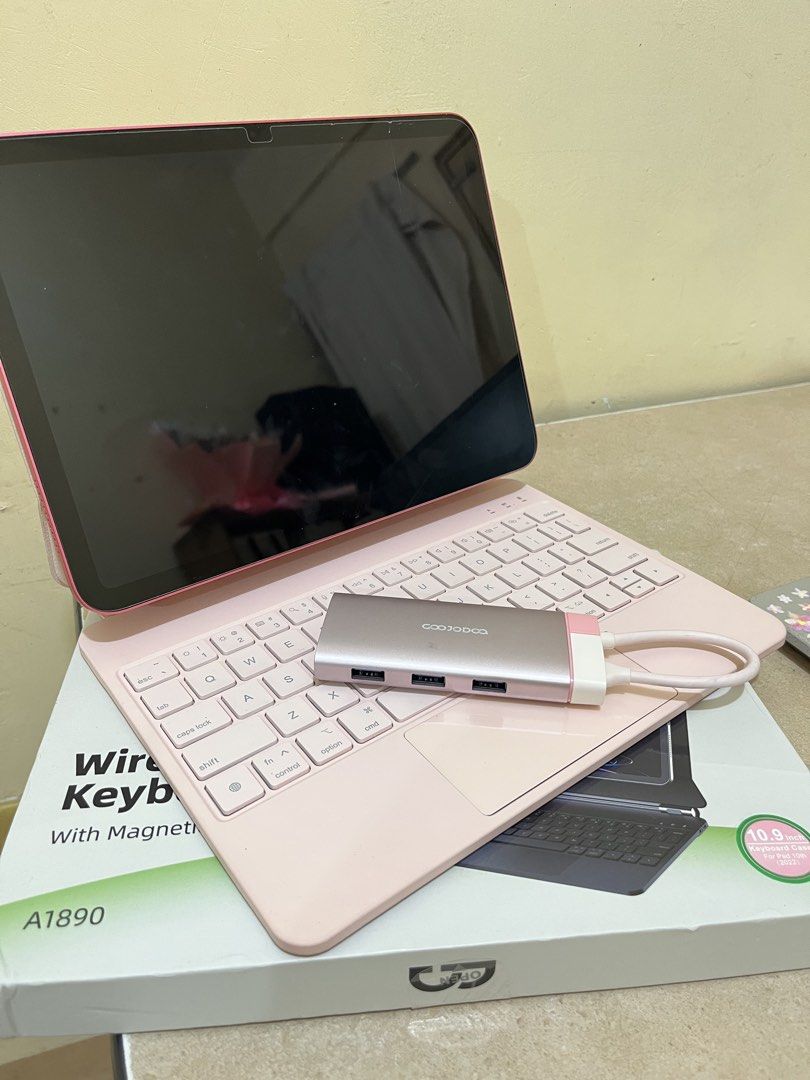 Pink Wireless Keyboard Case with Magnetic Function for Tablet (Category: Computer Keyboard) located in Taguig. Submitted by milllooo (Listing ID 1445747998, Image 1). Description: Take all for 2,500 Both brand: GOOJODOQ Original price 3,500 for case and HDMI/USB - Pink wireless keyboard case (Magnetic function) iPad 11th gen - 5in1 USB/HDMI hub (bnew, natapon na box) - box included for case -with free clear case for ipad 11th gen IPAD NOT INCLUDE
