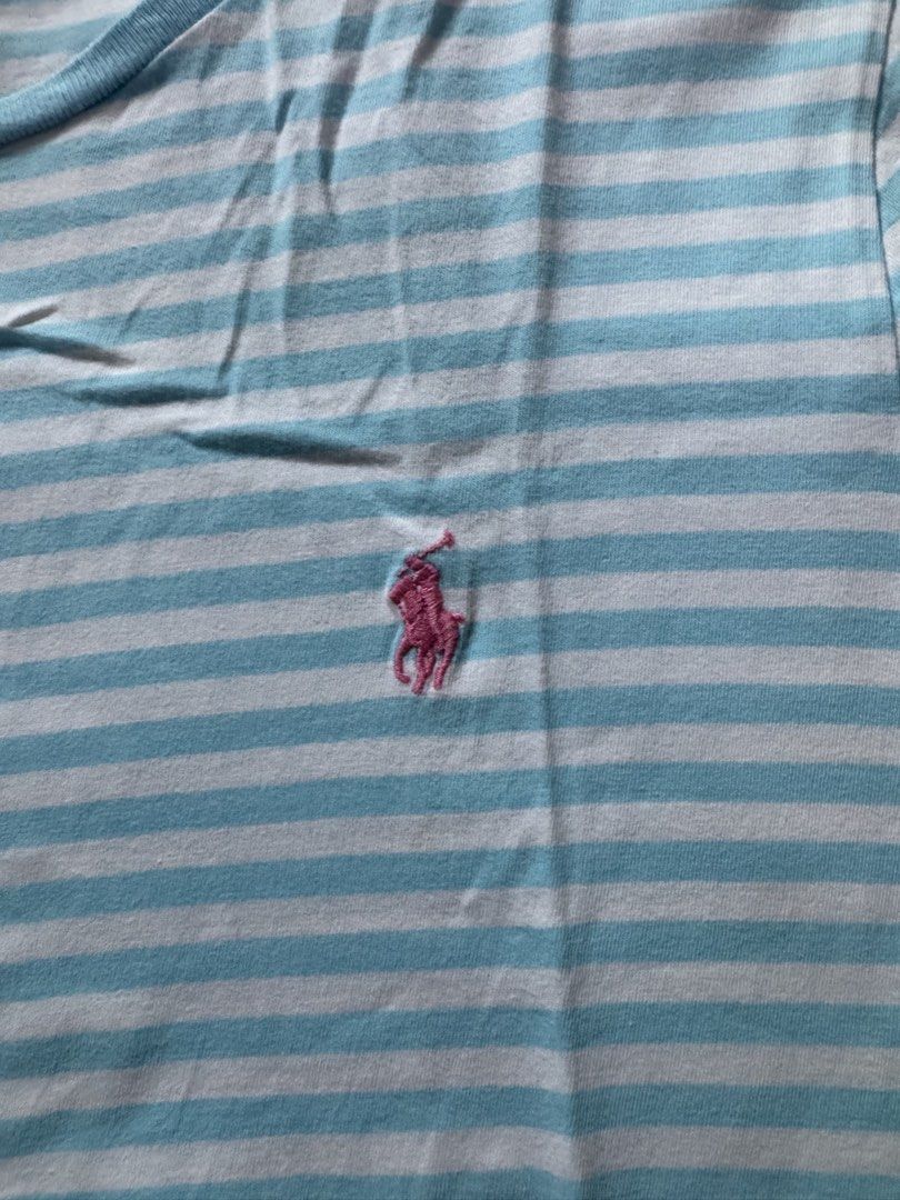 Polo Ralph Lauren tshirt (Category: Tshirts & Polo Shirts ) located in Makati City. Submitted by reallyGoodfinds (Listing ID 1445662798, Image 2). Description: - Brand: Polo Ralph Lauren - Color: Light blue and white stripes - Fit: Custom fit - Size: L - Features: Embroidered pink pony logo on chest - Origin: Made in Indonesia - Style: Great for casual wear -dimes on pic.