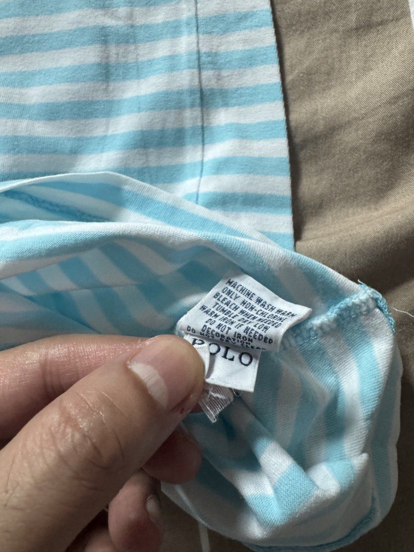 Polo Ralph Lauren tshirt (Category: Tshirts & Polo Shirts ) located in Makati City. Submitted by reallyGoodfinds (Listing ID 1445662798, Image 3). Description: - Brand: Polo Ralph Lauren - Color: Light blue and white stripes - Fit: Custom fit - Size: L - Features: Embroidered pink pony logo on chest - Origin: Made in Indonesia - Style: Great for casual wear -dimes on pic.