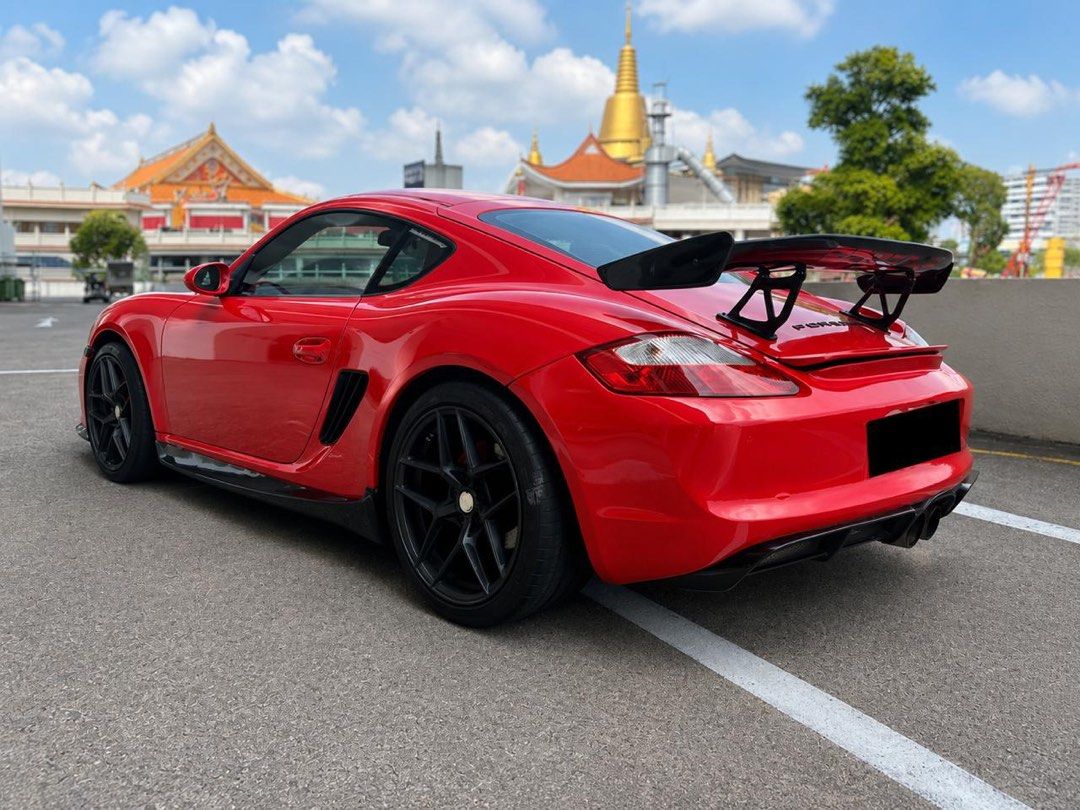 Porsche Cayman 7A Tiptronic Auto (Category: Used Cars) located in Singapore. Submitted by justinchiou (Listing ID 1445647356, Image 3). Description: 2.7L flat-6 boxer engine, 242 horsepower, 5-speed Tiptronic s auto, RWD, 0-100 in 6.5 seconds and top speed of 258 km/h Sports rims, upgraded brakes, upgraded BT head unit, reverse sensor, auto climate control, parking sensors, OBU. Upgraded Suspension BC Racing GT3 body kit upgraded with red wrap to