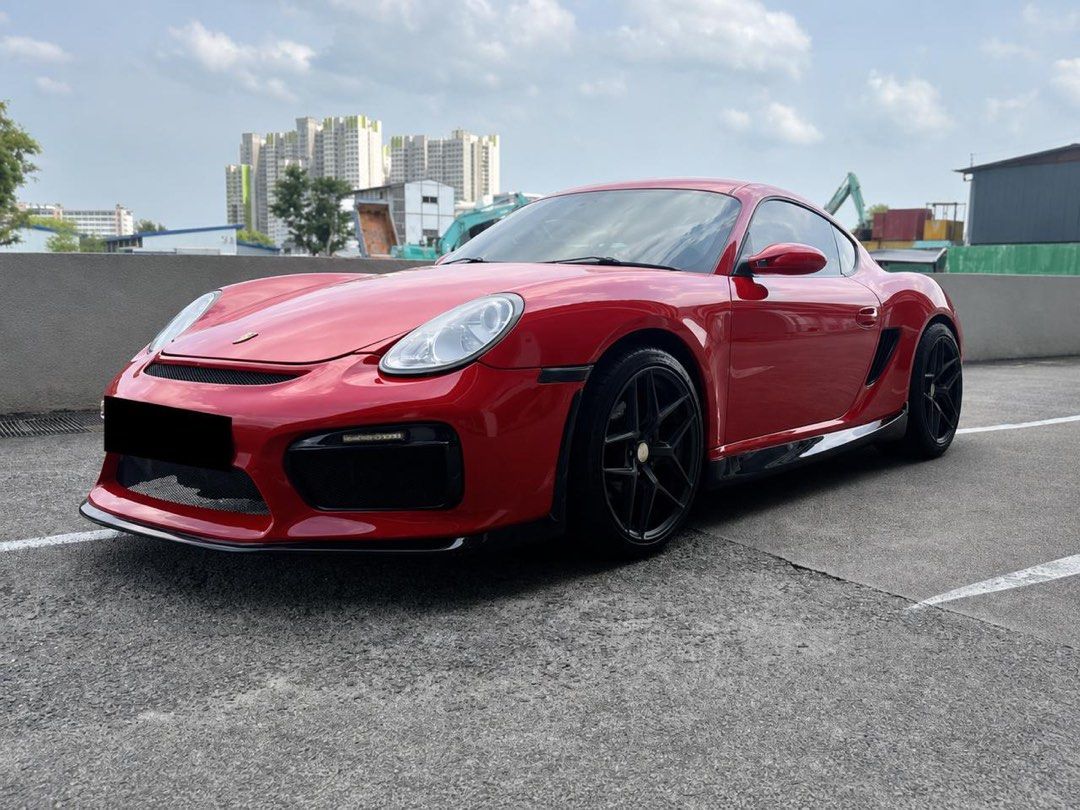 Porsche Cayman 7A Tiptronic Auto (Category: Used Cars) located in Singapore. Submitted by justinchiou (Listing ID 1445647356, Image 2). Description: 2.7L flat-6 boxer engine, 242 horsepower, 5-speed Tiptronic s auto, RWD, 0-100 in 6.5 seconds and top speed of 258 km/h Sports rims, upgraded brakes, upgraded BT head unit, reverse sensor, auto climate control, parking sensors, OBU. Upgraded Suspension BC Racing GT3 body kit upgraded with red wrap to