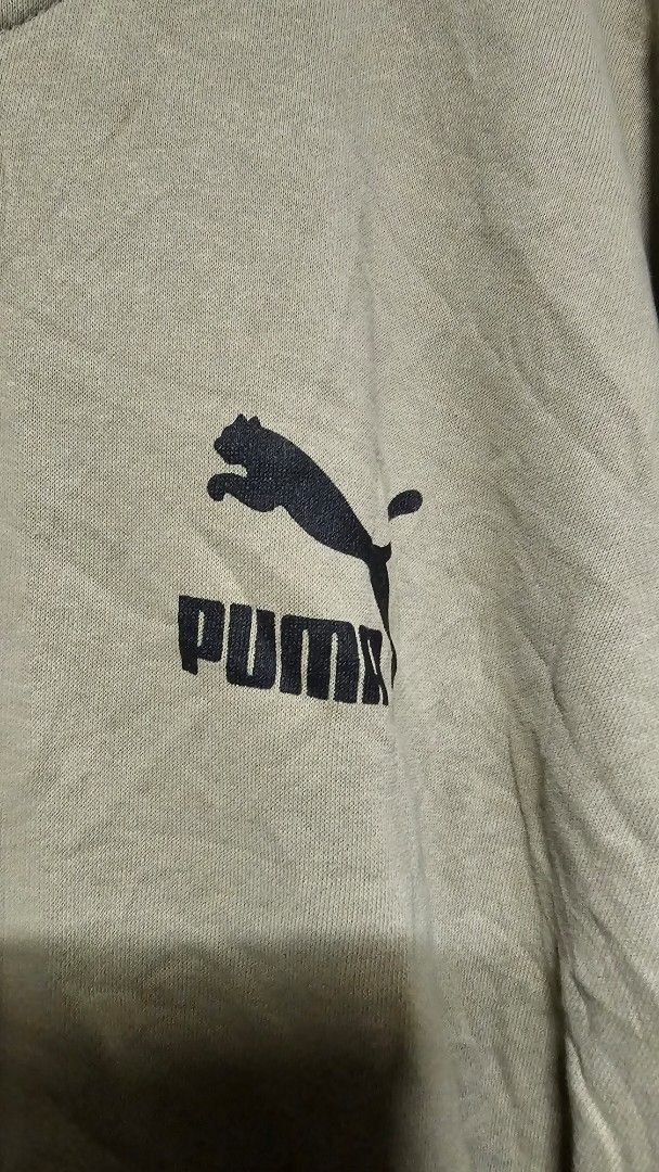 Puma Zip-Up Hoodie Jacket Size L (Category: Coats, Jackets and Outerwear) located in Manila. Submitted by thrift_archive (Listing ID 1445731460, Image 2). Description: - Puma zip-up hoodie - Color: Light green - Size: L - Features classic Puma logo on chest - Drawstring hood with metal-tipped cords - Ribbed cuffs and hem - Ideal for casual wear dimes 29w x 28L.