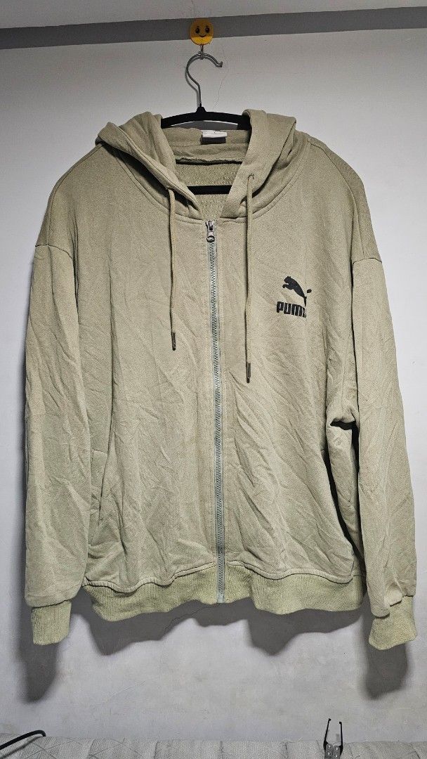 Puma Zip-Up Hoodie Jacket Size L (Category: Coats, Jackets and Outerwear) located in Manila. Submitted by thrift_archive (Listing ID 1445731460, Image 1). Description: - Puma zip-up hoodie - Color: Light green - Size: L - Features classic Puma logo on chest - Drawstring hood with metal-tipped cords - Ribbed cuffs and hem - Ideal for casual wear dimes 29w x 28L.