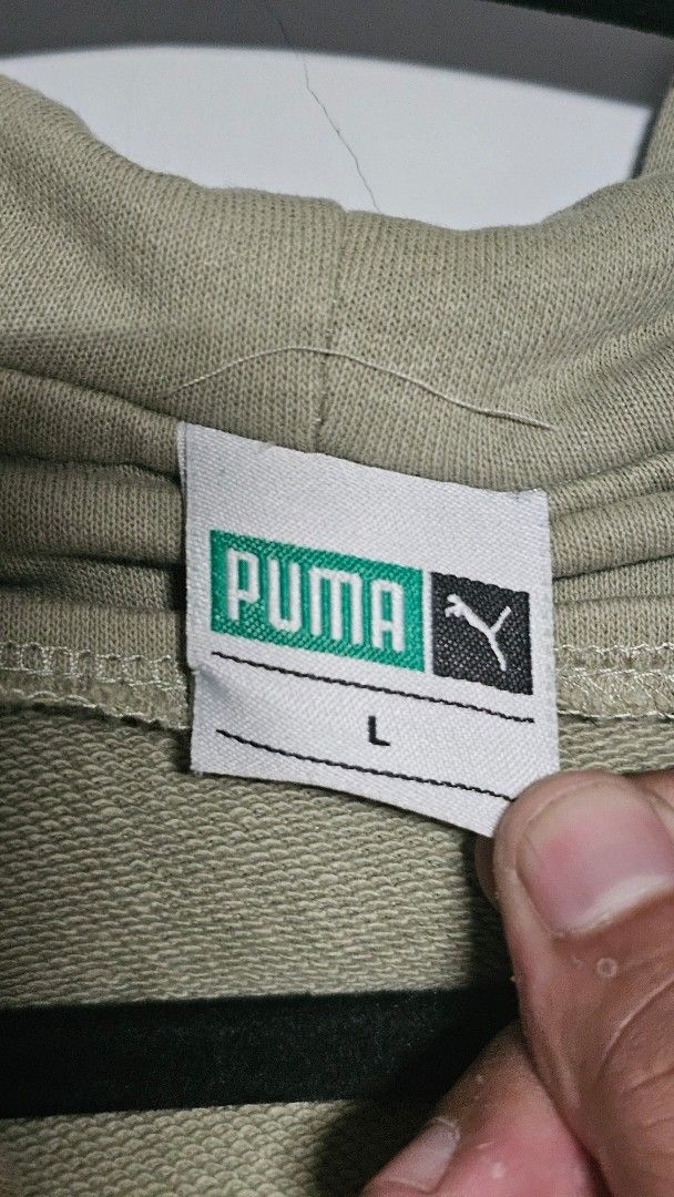 Puma Zip-Up Hoodie Jacket Size L (Category: Coats, Jackets and Outerwear) located in Manila. Submitted by thrift_archive (Listing ID 1445731460, Image 3). Description: - Puma zip-up hoodie - Color: Light green - Size: L - Features classic Puma logo on chest - Drawstring hood with metal-tipped cords - Ribbed cuffs and hem - Ideal for casual wear dimes 29w x 28L.