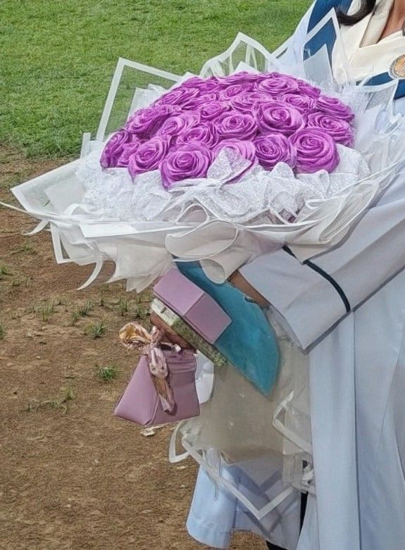 Purple Rose Satin Bouquet (Category: Flowers & Bouquets) located in Manila. Submitted by aian25 (Listing ID 1445788498, Image 2). Description: - 30 Rose satin flowers - Any color available - Add fee for rush order - Can send more pictures LOC: QC Mode of Payment: GCASH PAYMENT (need downpayment) Mode of Delivery: • Lalamove (buyer will shoulder the delivery fee) * meet up for pick up (around ust).