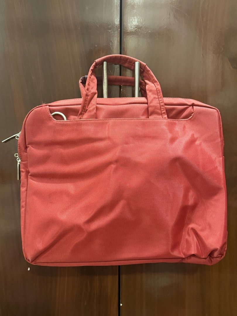 Red Halo Laptop Bag (Category: Laptop Bags & Sleeves) located in Paranaque City. Submitted by fami.liar (Listing ID 1445623026, Image 2). Description: - Red Halo laptop bag - Front zip pocket for quick access - Spacious main compartment - Clean interior lining - Sturdy and comfortable handles - Ideal for carrying laptops and daily essentials - Super matibay, bumagsak na macbook ko while in this bag and walang damage. - looks new RFS: I have a new