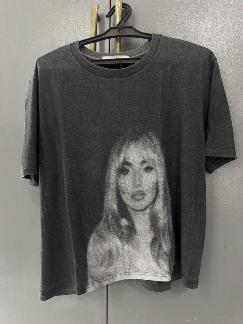 Sabrina Carpenter Cropped T-shirt (Category: Shirts) located in Manila. Submitted by grandemd (Listing ID 1445721550, Image 1). Description: - Vintage wash grey t-shirt - Features a black and white portrait graphic on the front - Classic crew neck and short sleeves - Comfortable fit for casual wear.